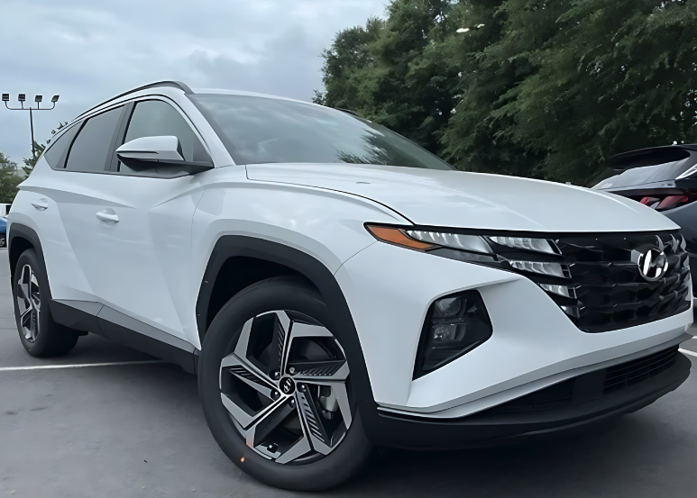 Front and side view of a white Hyundai Tucson parked outdoors, perfect for leasing options at Crain Hyundai of Little Rock